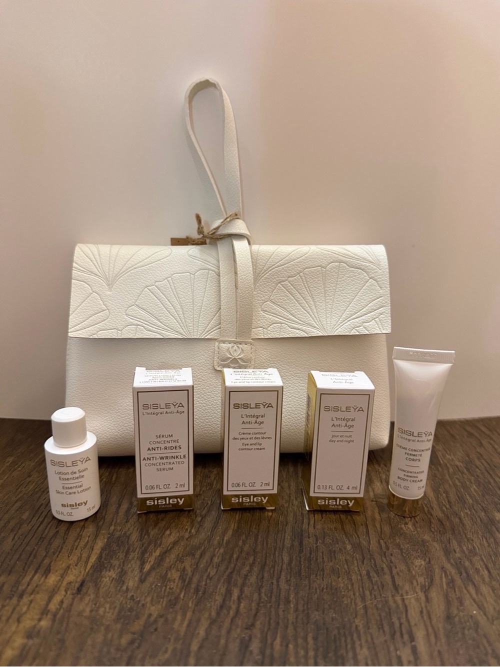 Sisley Cream Wristlet Clutch with Fan-Embossed Flap